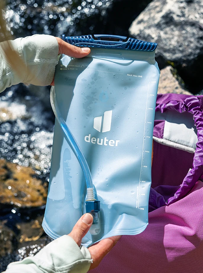 Close-up of a deuter Streamer reservoir featuring a HydraPak Slide-Seal top, ready to be loaded into a deuter hiking pack.